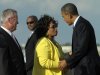 President Barack Obama greets Rep. Corrine Brown, D-Fla., center, as Orlando Mayor Buddy Dyer, left, looks on after arriving at Orlando International Airport in Orlando, Fla., to attend two fundraisers, Tuesday, Oct. 11, 2011. (AP Photo/Susan Walsh)