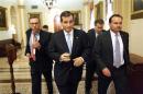 Cruz and Lee depart the Senate floor after their speeches before the night-time budget vote at the U.S. Capitol in Washington