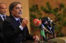 Ali Tarhouni, head of the committee drafting a new constitution for Libya, speaks during a news conference in Benghazi