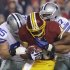 Washington Redskins running back Alfred Morris is tackled by Dallas Cowboys nose tackle Sean Lissemore (95) and defensive end Jason Hatcher (97) during the first half of an NFL football game Sunday, Dec. 30, 2012, in Landover, Md. (AP Photo/Alex Brandon)