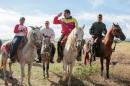 Venezuela's President Maduro rides a horse next to Defense Minister Padrino Lopez during an event related to a government plan for planting and harvesting cereal crops in San Carlos