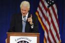 Former President Bill Clinton gestures as he speaks at a rally for Gov. Dannel P. Malloy, Monday, Oct. 13, 2014, in Hartford, Conn. (AP Photo/Jessica Hill)