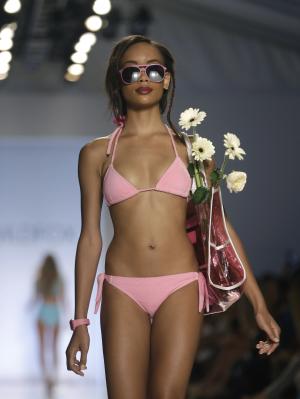 A model walks down the runway wearing swimwear designed&nbsp;&hellip;