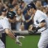 New York Yankees Swisher celebrates with Teixeira after hitting grand slam home run against Texas Rangers in MLB game in New York