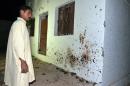 A Pakistani Shiite Muslim man looks at the site of a suicide bomb attack at a mosque in the town of Chalgari in restive Baluchistan, some 170 kilometres southeast of the provincial capital, Quetta, on October 22, 2015