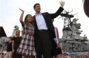 U.S. Congressman Paul Ryan (R-WI) waves with his daughter Liza as his wife Janna Little (2nd L) follows with their son Charlie (L) during a campaign event at the battleship USS Wisconsin in Norfolk
