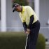 Thaworn Wiratchant , of Thailand, putts on the practice green during a practice round for the Masters golf tournament Monday, April 8, 2013, in Augusta, Ga. (AP Photo/David Goldman)