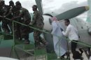 Sheikh Hassan Dahir Aweys, one of Somalia's most prominent Islamist rebel commanders, who was arrested on Wednesday, is escorted at Adado airstrip