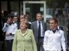 German Chancellor Merkel and the captain of the German national soccer team Lahm walk to attend a dinner in the team's Euro 2012 headquarters in Sopot