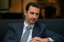 Handout picture by the Syrian Arab News Agency on December 4, 2014, shows Syrian President Bashar al-Assad in Damascus