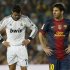 Barcelona's Messi walks past Real Madrid's Ronaldo during their Spanish first division soccer match at Nou Camp stadium in Barcelona