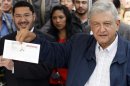 File photo of Lopez Obrador showing his registration form in Mexico City