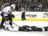 Blackhawks' Keith looks down at Kings' Jeff Carter after Keith hit Carter in the face with his stick in the second period of Game 3 of the NHL Western Conference final hockey playoff in Los Angeles