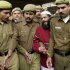FILE – In this Dec. 17, 2002 file photo, Kashmiri man accused in the parliament attack Mohammed Afzal Guru, second right, is produced at a court in New Delhi, India. Afzal, convicted in the 2001 attack on India's Parliament, has been hanged in an Indian prison, a senior Indian Home Ministry official said Saturday, Feb. 9, 2013. The deadly Islamic militant attack killed 14 people, including the five attackers in 2001. (AP Photo/Aman Sharma, File)