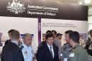Kevin Andrews (C), Australia's Minister for Defence, inspects a Royal Australian Navy helicopter flight simulator at the Australian International Airshow at the Avalon Airfield on February 27, 2015