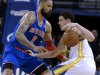 Golden State Warriors' Klay Thompson, right, drives against the New York Knicks' Tyson Chandler (6) during the first half of an NBA basketball game Monday, March 11, 2013, in Oakland, Calif. (AP Photo/Ben Margot)