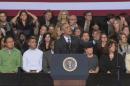 Obama takes on hecklers over immigration policy