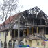 A police van stands  in front of a burnt-out house in Zwickau, eastern Germany  that was destroyed  by a supposed member of a far-right terror gang  on Nov. 4, Wednesday Nov. 16, 2011. Germany will create a national database as a clearing-house for information on far-right extremists amid mounting criticism its security agencies failed to detect a neo-Nazi terror group for years.  Interior Minister Hans-Peter Friedrich said Wednesday Nov. 16, 2011  the new databank will be modeled on a similar registry for Islamic extremists created in the wake of the Sept. 11 attacks. (AP Photo/dapd/ Joern Haufe)