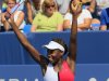 Venus Williams, of the United States, leaps after defeating Samantha Stosur, from Australia, 6-2, 6-7 (2), 6-4, during a quarterfinal at the Western & Southern Open tennis tournament, Friday, Aug. 17, 2012, in Mason, Ohio. (AP Photo/Al Behrman)