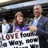 Sacramento Mayor Kevin Johnson stands with Sacramento Kings fan Barbara Rust as they celebrate the NBA relocation committee's recommendation to reject the application to relocate the Kings basketball team to Seattle, Monday, April 29, 2013, in Sacramento, Calif. (AP Photo/Rich Pedroncelli)