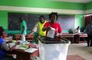 A woman votes during the presidential election in Libreville