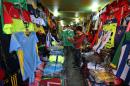An Iraqi man inspects an Iraqi football jersey at a store in the capital Baghdad on January 31, 2016
