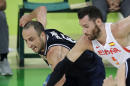 Argentina's Manu Ginobili, left, fights for a loose ball with Spain's Rudy Fernandez, right, during a basketball game at the 2016 Summer Olympics in Rio de Janeiro, Brazil, Monday, Aug. 15, 2016. (AP Photo/Charlie Neibergall)