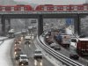 A heavy traffic is pictured on a snow covered motorway in Bochum