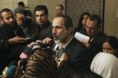 Syrian National Coalition leader Alkhatib speaks to the media after meeting with Arab League head in Cairo