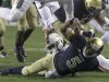Notre Dame quarterback Everett Golson (5) scrambles to the one yard line and is tackled by Miami linebacker Eddie Johnson during the first half of an NCAA college football game at Soldier Field Saturday, Oct. 6, 2012, in Chicago.(AP Photo/Charles Rex Arbogast)