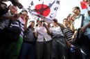 Demonstrators burn a crossed-out Japanese national flag during a protest in Xi'an