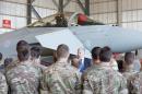 Britain's Defence minister Michael Fallon speaks to personnel as he visits the British airbase at Akrotiri, near Cyprus' second city of Limassol on December 5, 2015