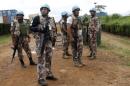 U.N. peacekeepers hold position at the MONUSCO base after dispersing demonstrators in Mavivi near Beni in North Kivu province