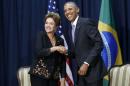 Obama shakes hands with Rousseff at their meeting during the Summit of the Americas in Panama City, Panama