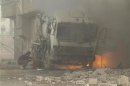 A fire burns after missiles were fired in Daraya