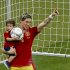 Spain's Fernando Torres holds his son Leo after an award ceremony as Spain won the Euro 2012 soccer championship final between Spain and Italy in Kiev, Ukraine, early Monday, July 2, 2012. (AP Photo/Vadim Ghirda)