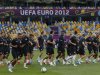 England squad warm up during a training session ahead of their Euro 2012 soccer match against Sweden at the Olympic stadium in Kiev