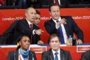Russian President Vladimir Putin and Britain's Prime Minister David Cameron point as watch women's -78kg and men's 100kg judo competition at London 2012 Olympic Games