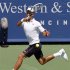 Novak Djokovic of Serbia hits a return to Juan Martin Del Potro of Argentina in their men's singles semi-final match at the Cincinnati Open tennis tournament in Cincinnati