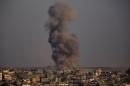 Smoke rises after an Israeli airstrike in Gaza City, Sunday, Aug. 3, 2014. (AP Photo/Dusan Vranic)