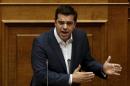 Greek PM Tsipras delivers a speech during a parliamentary session before a vote of confidence at the parliament building in Athens