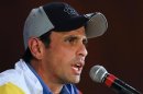 Venezuela's defeated opposition presidential candidate Henrique Capriles gives a news conference in Caracas