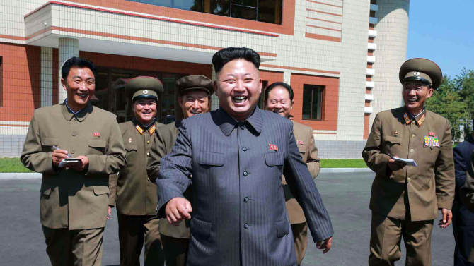 Undated photo released on August 31, 2014 shows North Korean leader Kim Jong-Un visiting the renewed October 8 factory