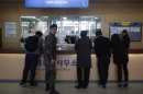 A South Korean soldier looks back as journalists talk with a officer at South Korea's CIQ (Customs, Immigration and Quarantine) office, just south of the demilitarised zone separating the two Koreas, in Paju