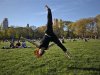 A woman practices aerobic moves in New York's Central Park