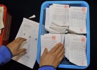 A South Korean election official count ballots for the presidential election at a high school gymnasium in Seoul on December 19, 2012