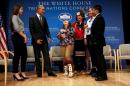 Obama gets a laugh out of young Native Americans after taking part in the annual White House Tribal Nations Conference in Washington