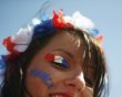 France soccer fan poses in front of the Donbass Arena stadium in Donetsk