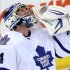 Toronto Maple Leafs goaltender James Reimer looks up as he celebrates the defeating the Ottawa Senators 4-1 after  an NHL game in Ottawa Saturday April 20, 2013. (AP Photo/The Canadian Press, Fred Chartrand)