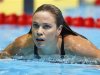 Natalie Coughlin swims from the pool after winning the women's 100m butterfly semifinal during the U.S. Olympic swimming trials in Omaha
